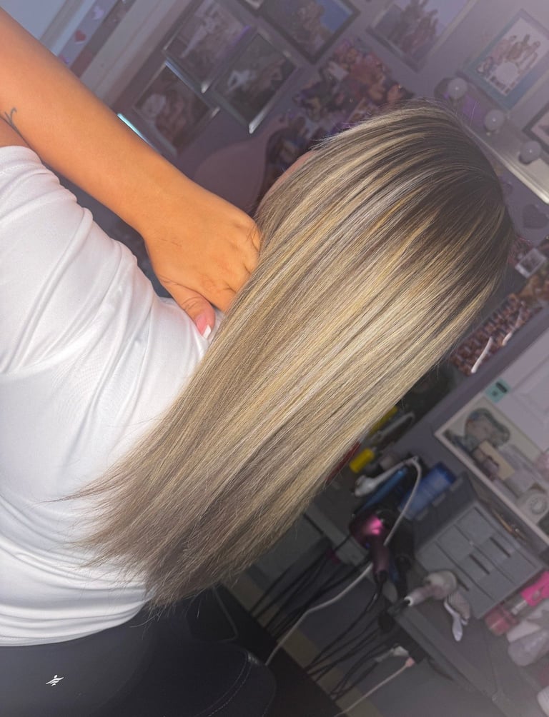 Foil highlight blonde hair color created at CC Styling Studio in Bradenton, FL — long highlighted blonde hair viewed from behind