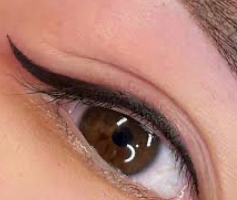 Close-up of a brown eye with black eyeliner, defined crease, and light eyeshadow highlighting the lid at CC Styling Studio Bradenton FL
