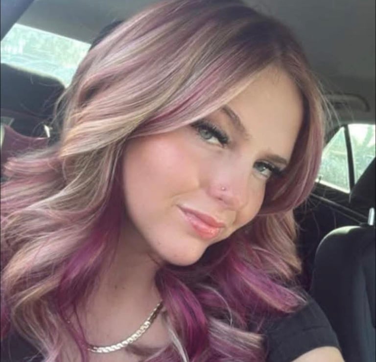 Purple and pink ombre hair color on long wavy hair in Bradenton, Florida by CC Styling Studio