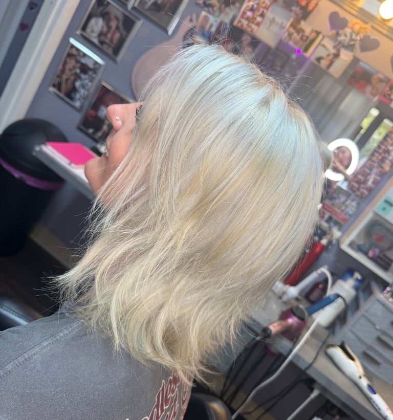 Blonde specialist hair color at CC Styling Studio in Bradenton, FL — platinum blonde shoulder-length hair brought down to a level 12 by an advanced color specialist