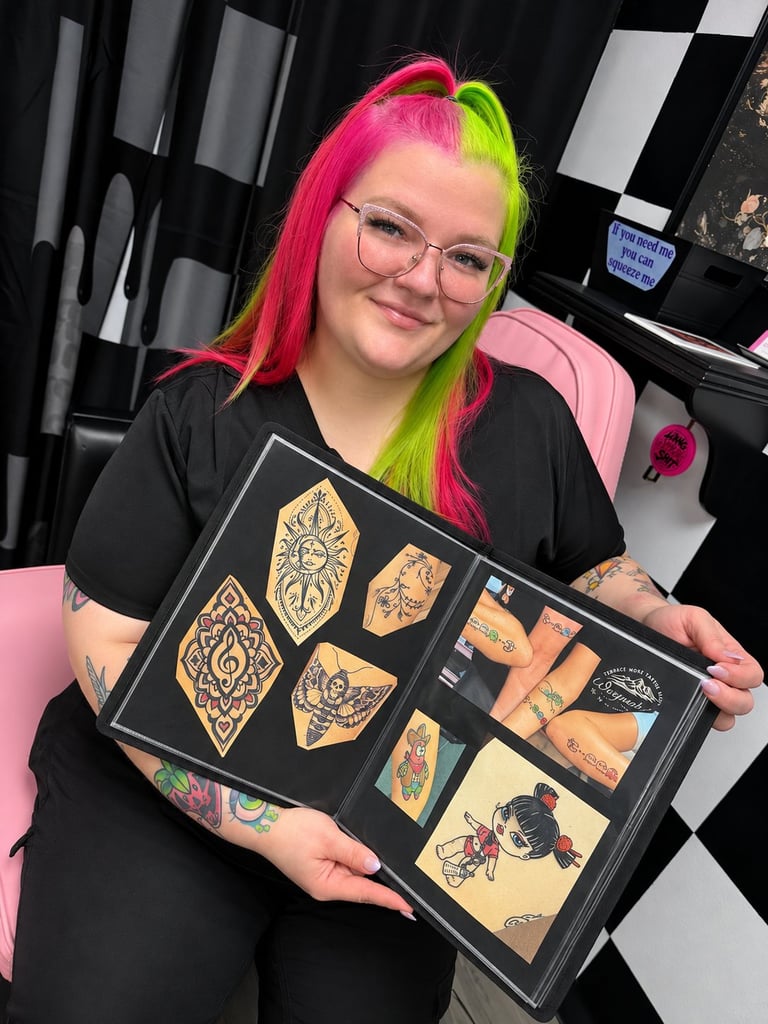 Tattoo artist at CC Styling Studio in Bradenton, Florida showing a portfolio of custom tattoo designs